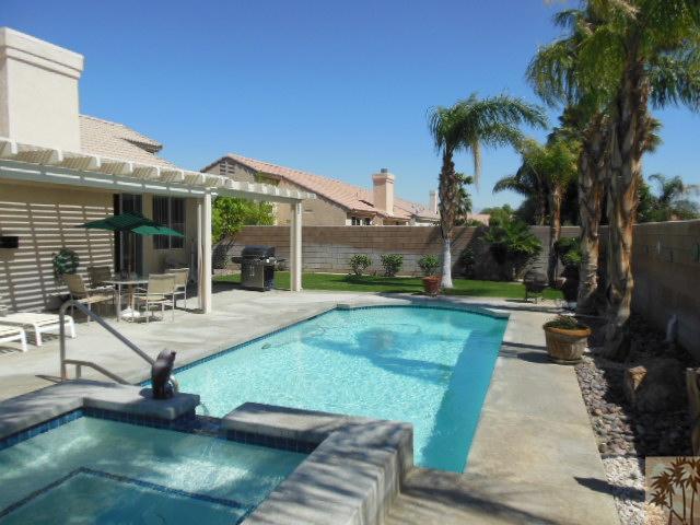 68451 Riviera Road Cathedral City, CA 92234 - Photo 7 of 8 a view of a house with backyard swimming pool and sitting area