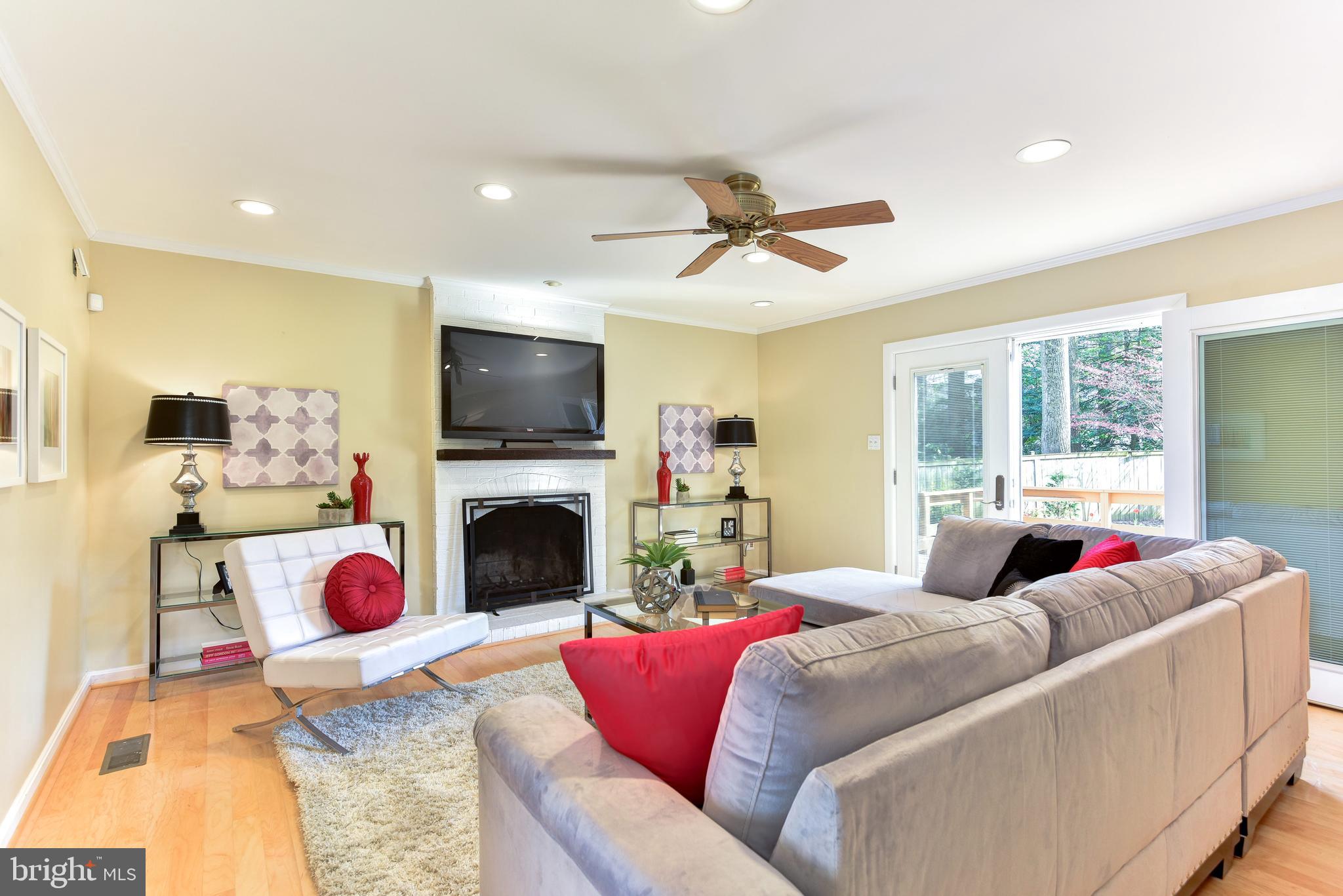 11803 Tree Fern Court Reston, VA 20191 - Photo 13 of 38 Family Room with Fireplace & Adjoining Deck
