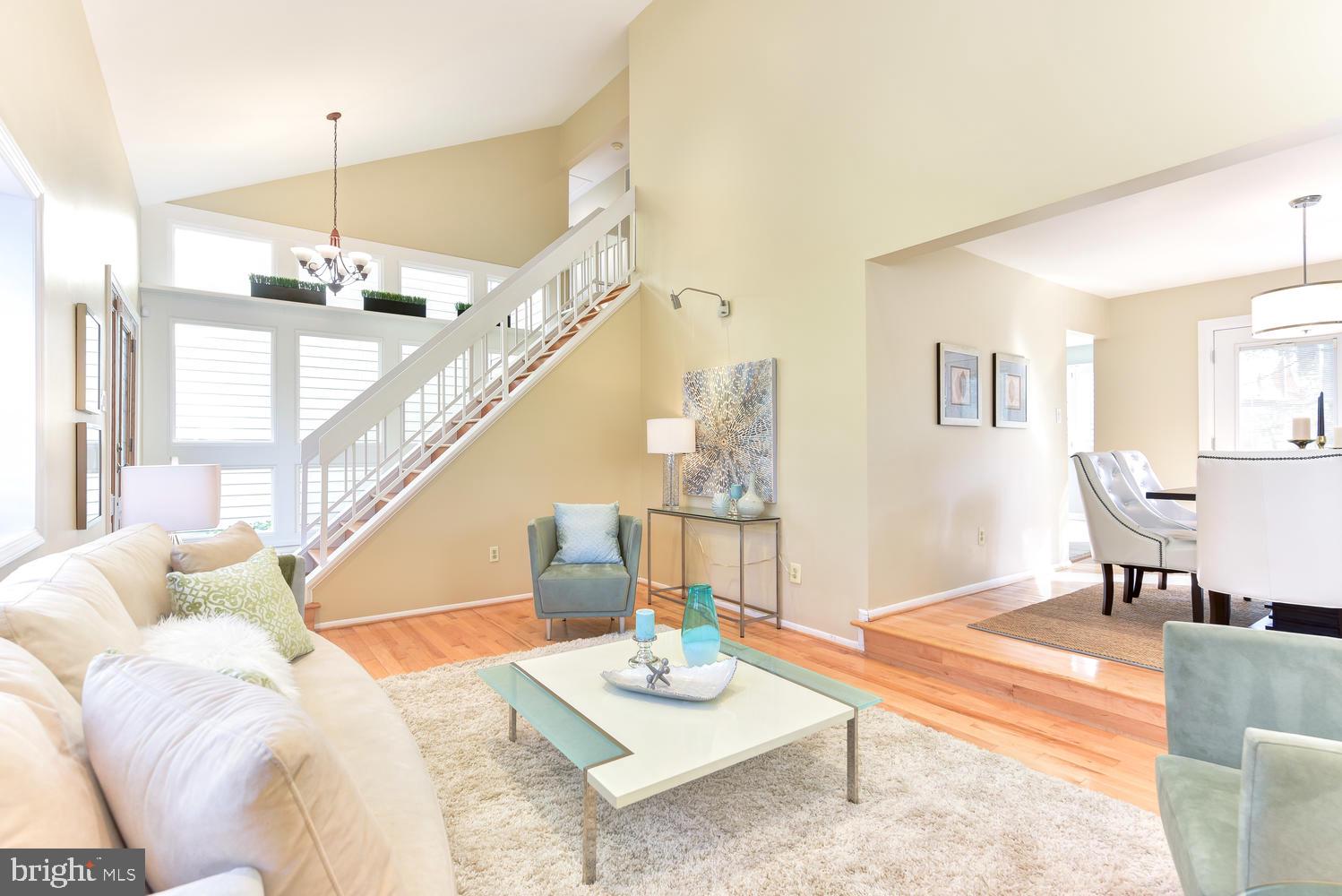 11803 Tree Fern Court Reston, VA 20191 - Photo 3 of 38 Living Room and Foyer With Vaulted Ceilings