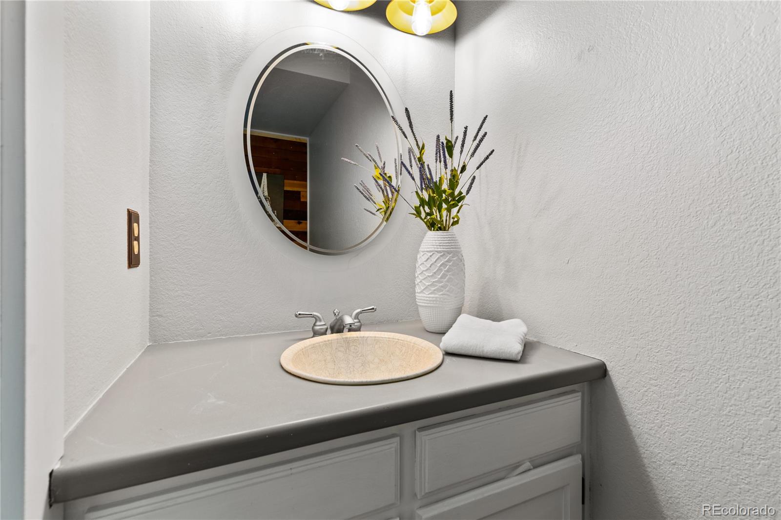 5092 Buckingham Road Boulder, CO 80301 - Photo 12 of 25 a bathroom with a sink and a mirror