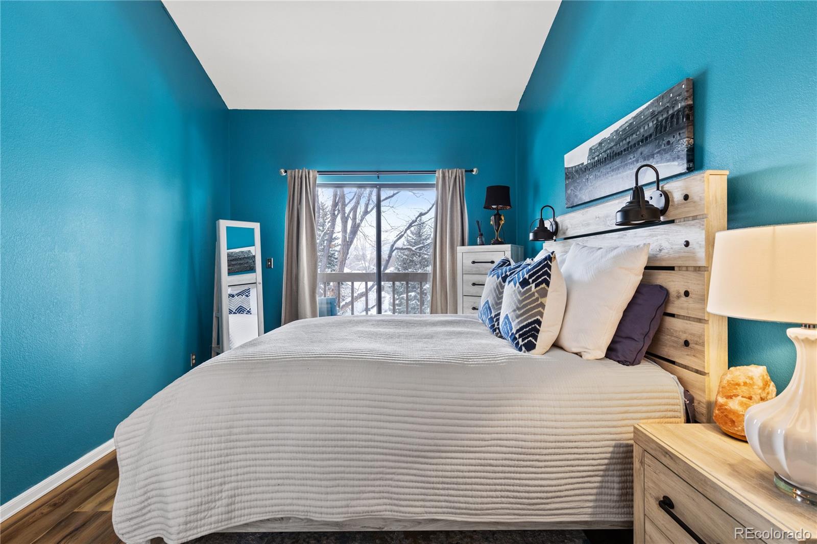 5092 Buckingham Road Boulder, CO 80301 - Photo 13 of 25 a bedroom with a bed and large windows
