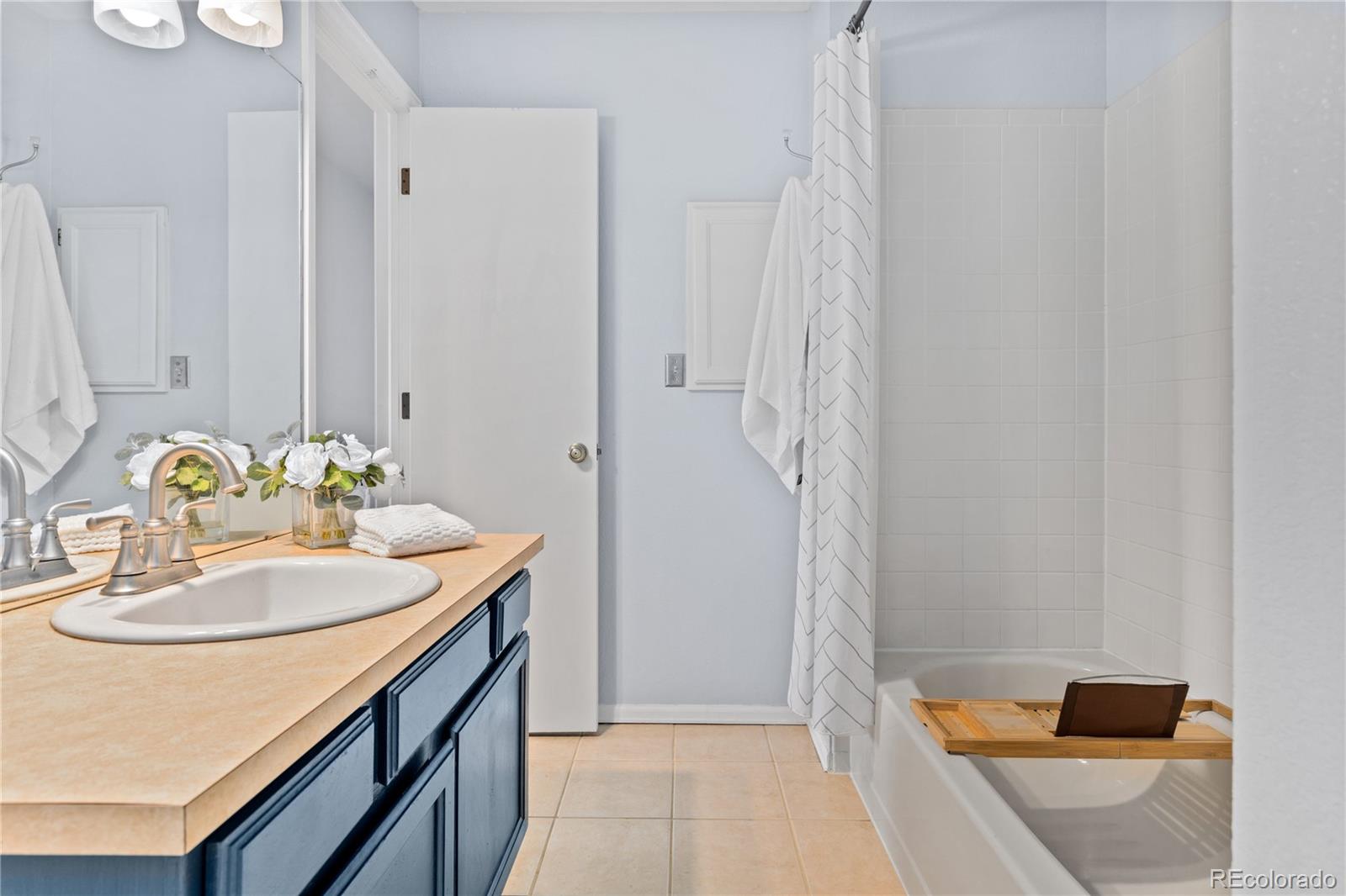 5092 Buckingham Road Boulder, CO 80301 - Photo 16 of 25 a bathroom with a sink and a mirror