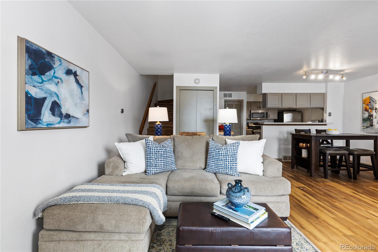 5092 Buckingham Road Boulder, CO 80301 - Photo 4 of 25 a living room with furniture and a chandelier