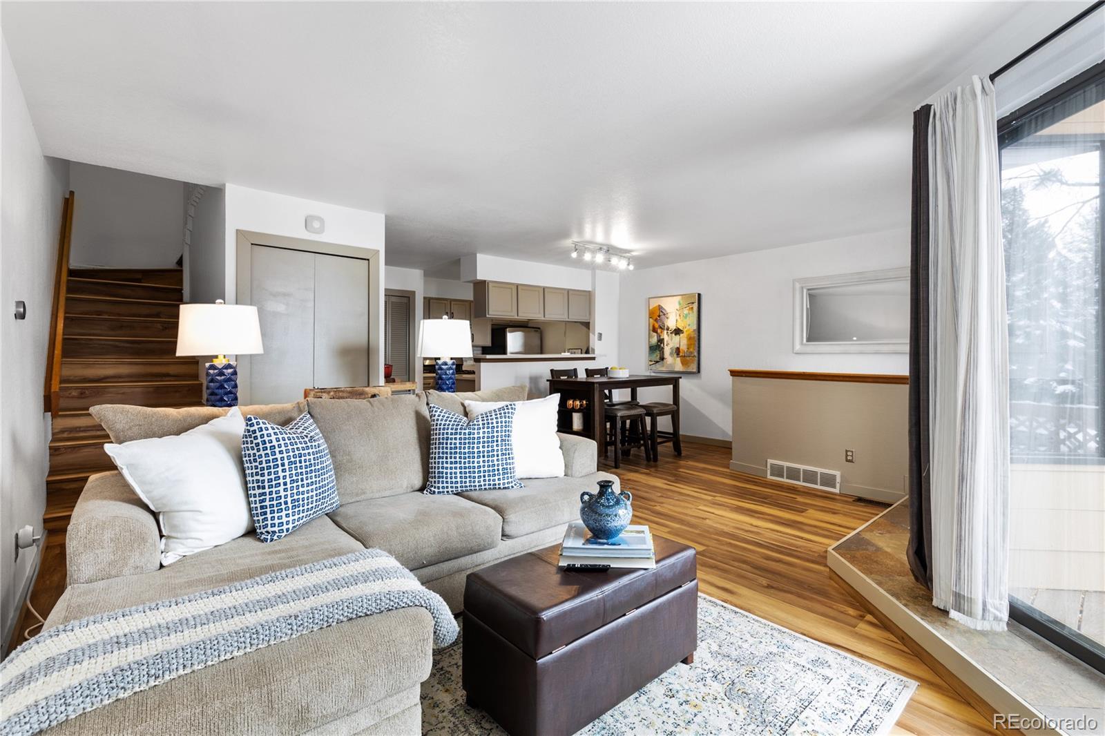 5092 Buckingham Road Boulder, CO 80301 - Photo 5 of 25 a living room with furniture wooden floor and a large window