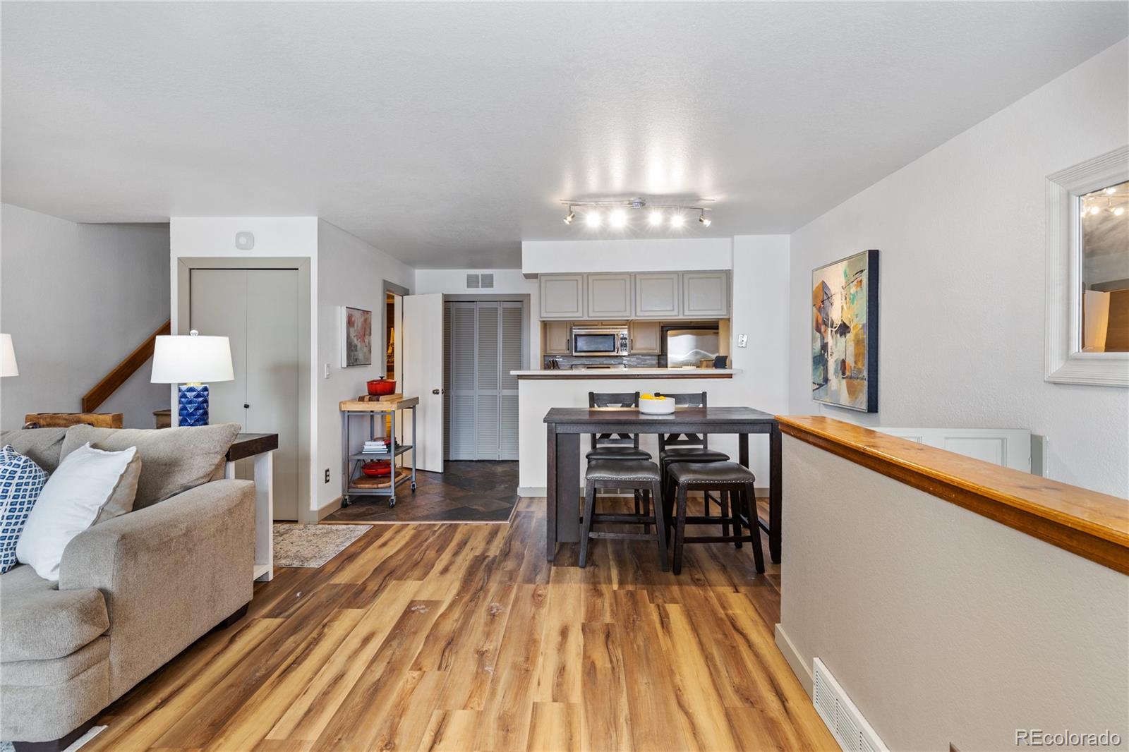 5092 Buckingham Road Boulder, CO 80301 - Photo 6 of 25 a living room with furniture and a chandelier