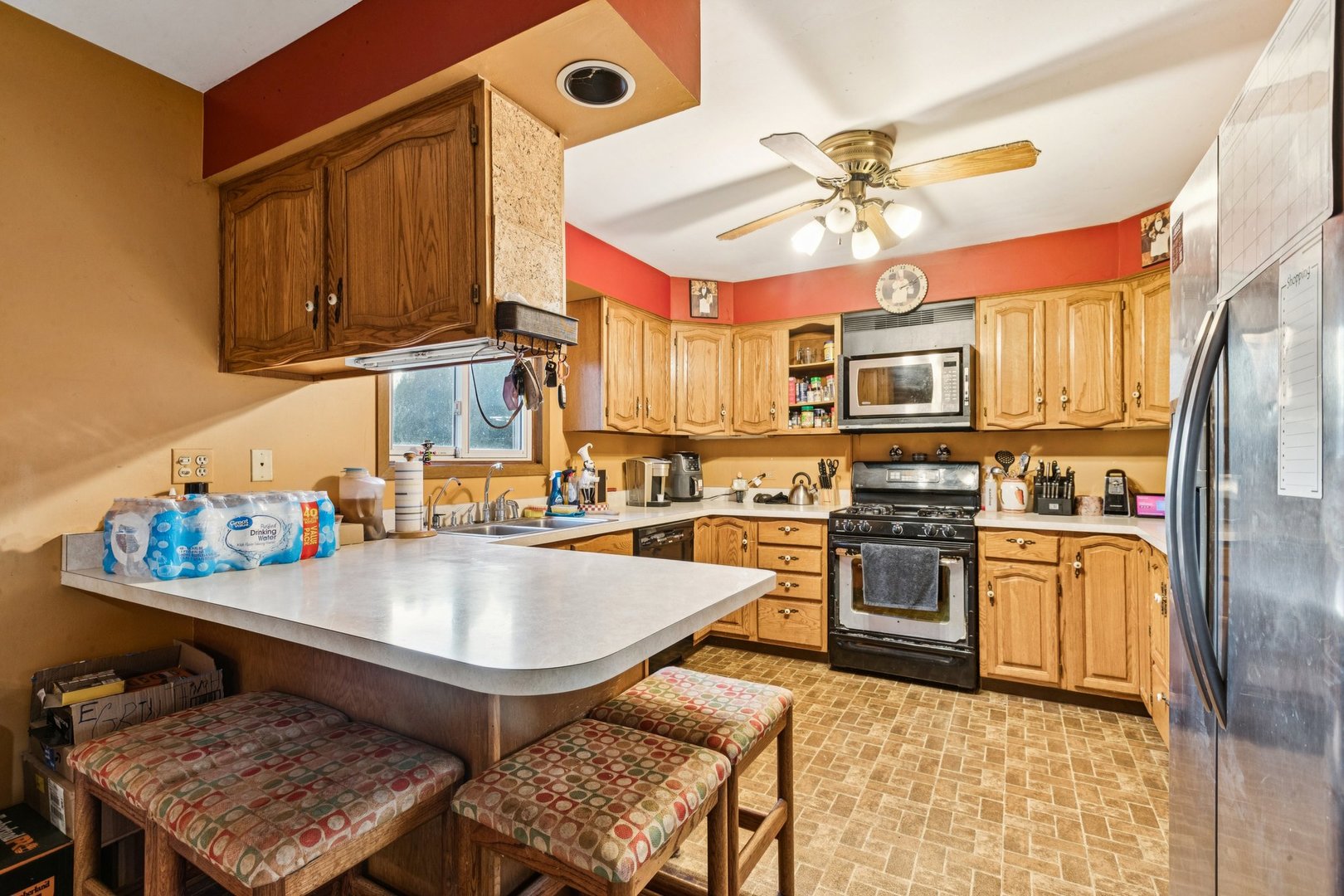 25283 Timber Lane Lake Villa, IL 60046 - Photo 11 of 49 a kitchen with stainless steel appliances granite countertop a sink dishwasher stove refrigerator and cabinets