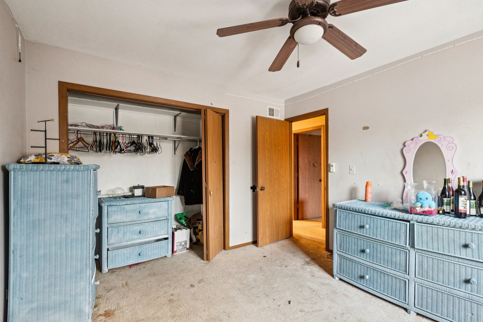 25283 Timber Lane Lake Villa, IL 60046 - Photo 23 of 49 a bedroom with a bed and a chandelier