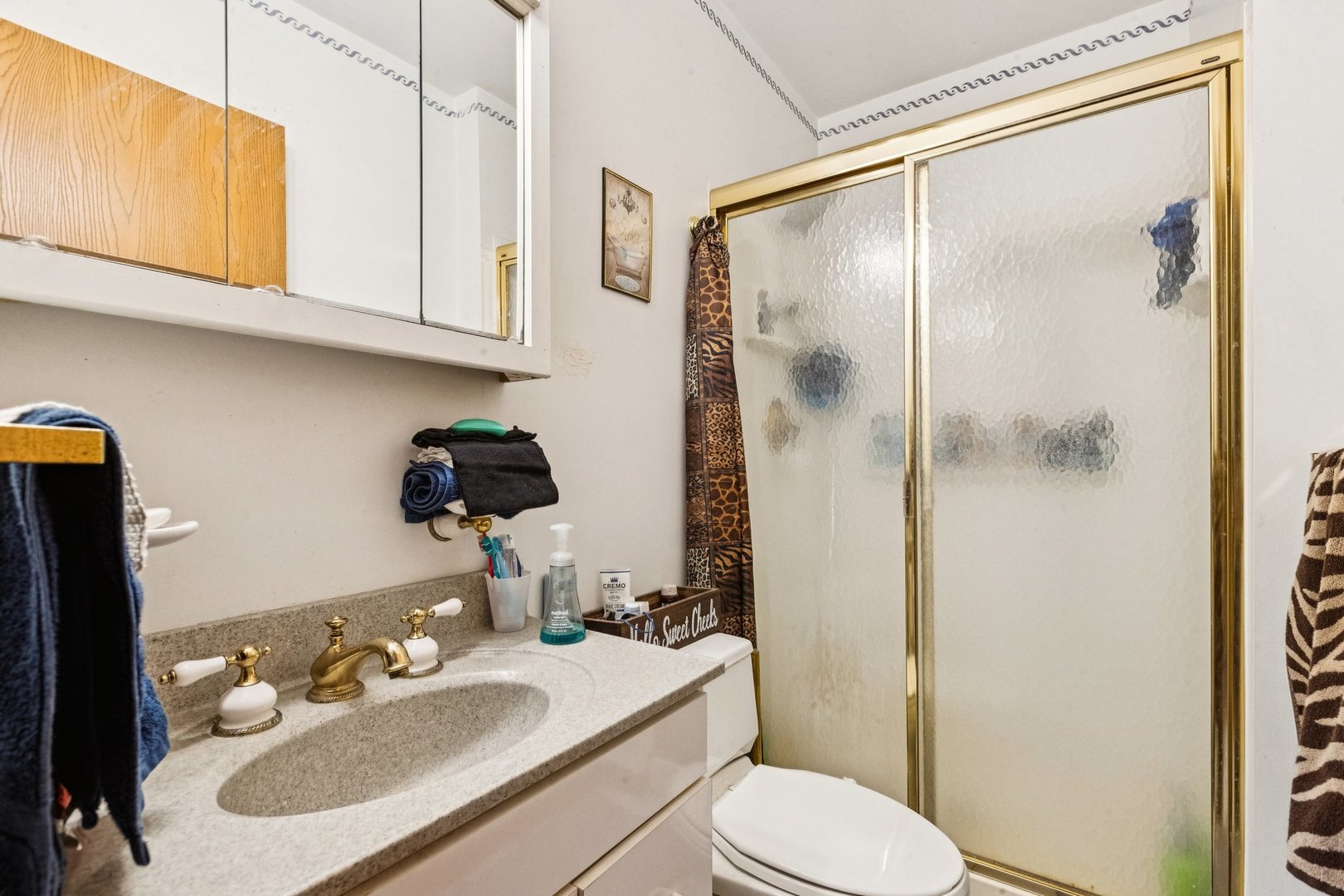 25283 Timber Lane Lake Villa, IL 60046 - Photo 32 of 49 a bathroom with a sink toilet and shower