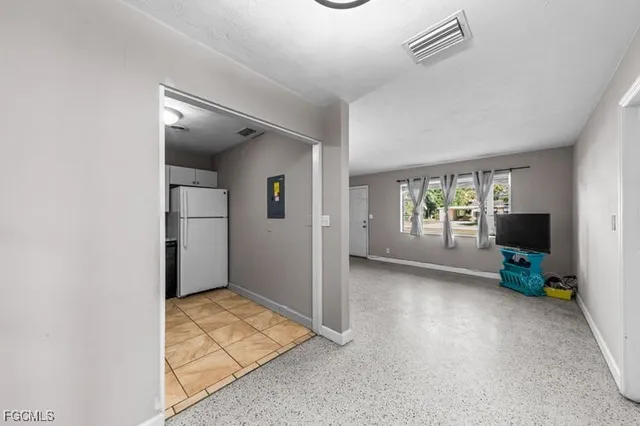 a view of livingroom with furniture and a flat screen tv