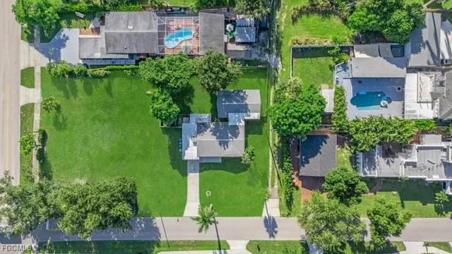 an aerial view of a house with a garden and yard