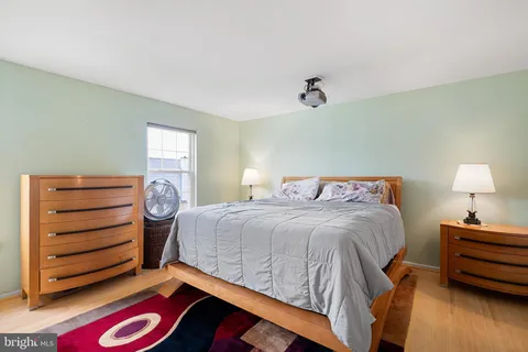 a bedroom with a bed and a closet