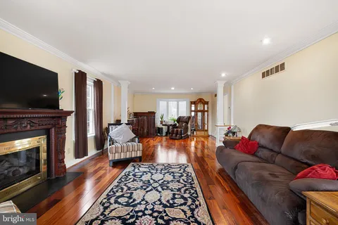 a living room with furniture fireplace and flat screen tv