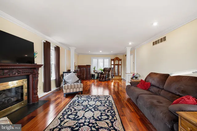 a living room with furniture fireplace and flat screen tv