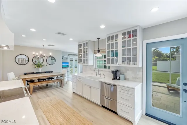 a living room with dining table and chairs
