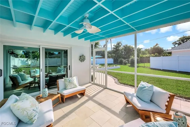 a view of a swimming pool and lounge chairs