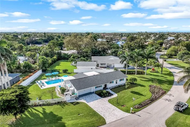 an aerial view of residential houses with outdoor space