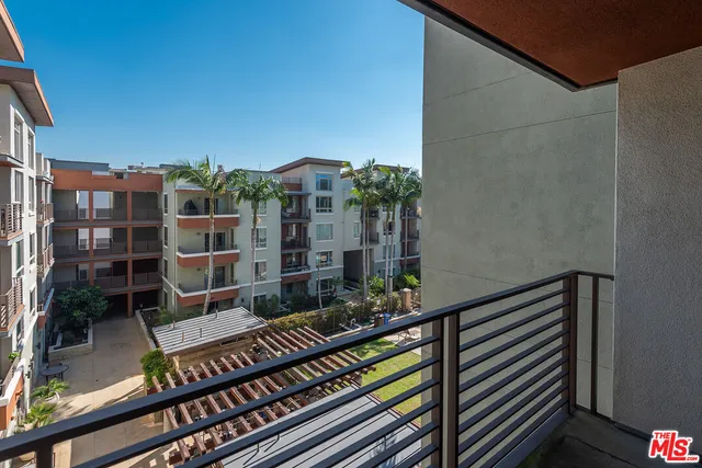 a view of balcony with furniture