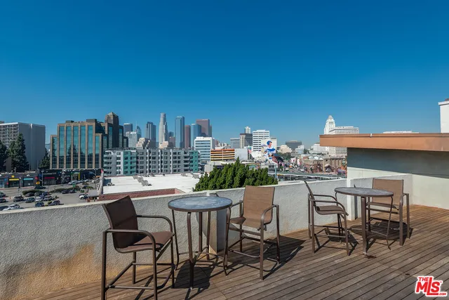 a dining area with a table and chairs