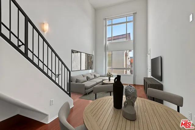 a living room with furniture fireplace and a flat screen tv