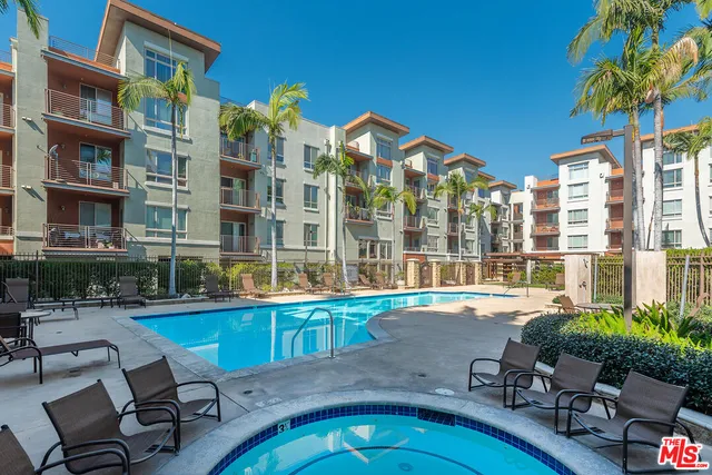 a view of a swimming pool with chairs