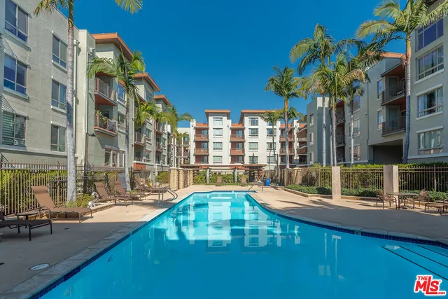 a view of swimming pool with outdoor seating