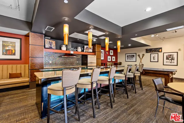 a room with furniture pool table table tennis table soccer and windows