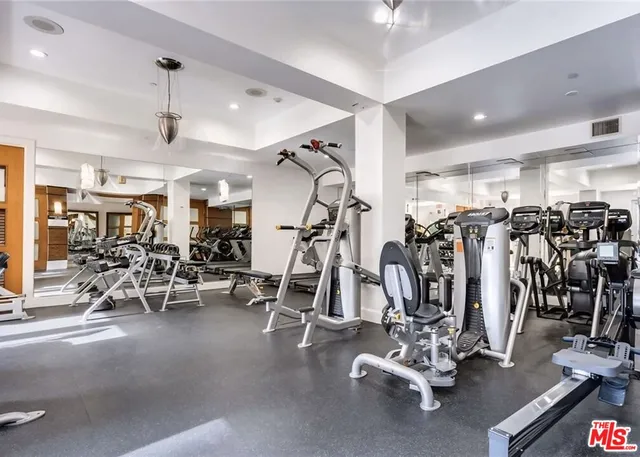 a front view of a building with potted plants