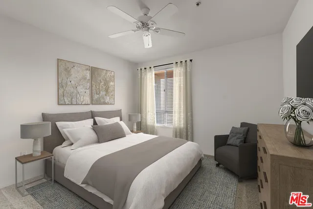 a bedroom with bed and a couch