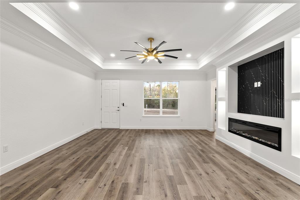 8725 Southwest 136th Terrace Dunnellon, FL 34432 - Photo 20 of 78 wooden floor in an empty room with a window
