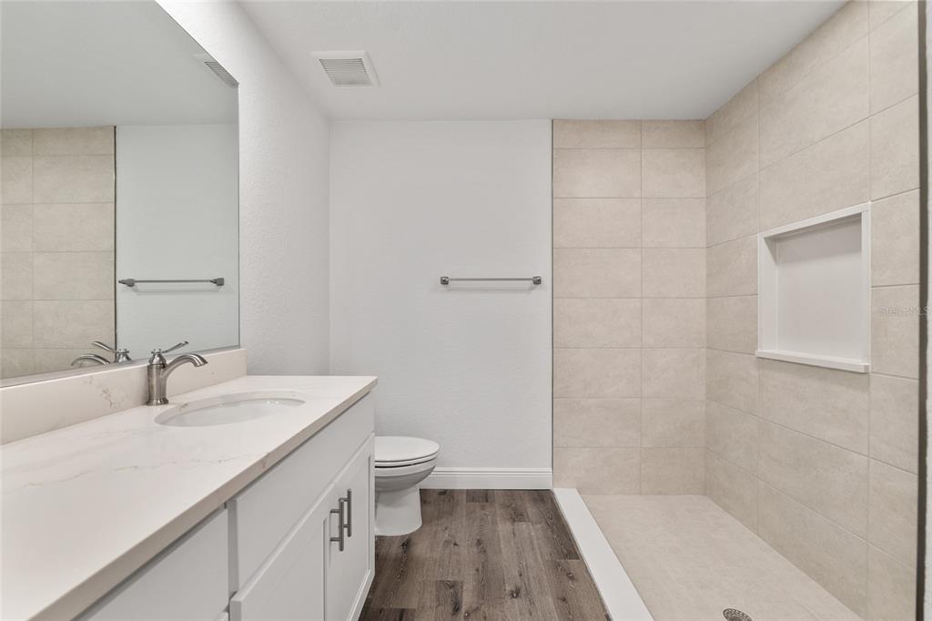 8725 Southwest 136th Terrace Dunnellon, FL 34432 - Photo 43 of 78 a bathroom with a sink a toilet and shower