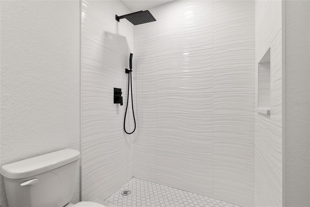 8725 Southwest 136th Terrace Dunnellon, FL 34432 - Photo 51 of 78 a bathroom with a shower