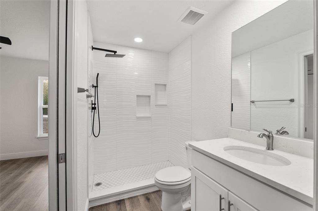 8725 Southwest 136th Terrace Dunnellon, FL 34432 - Photo 54 of 78 a bathroom with a sink toilet and shower