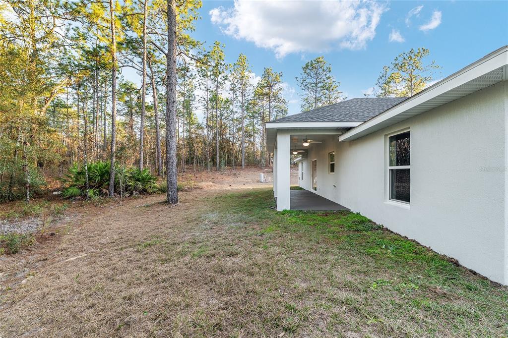 8725 Southwest 136th Terrace Dunnellon, FL 34432 - Photo 65 of 78 a view of a house with a yard