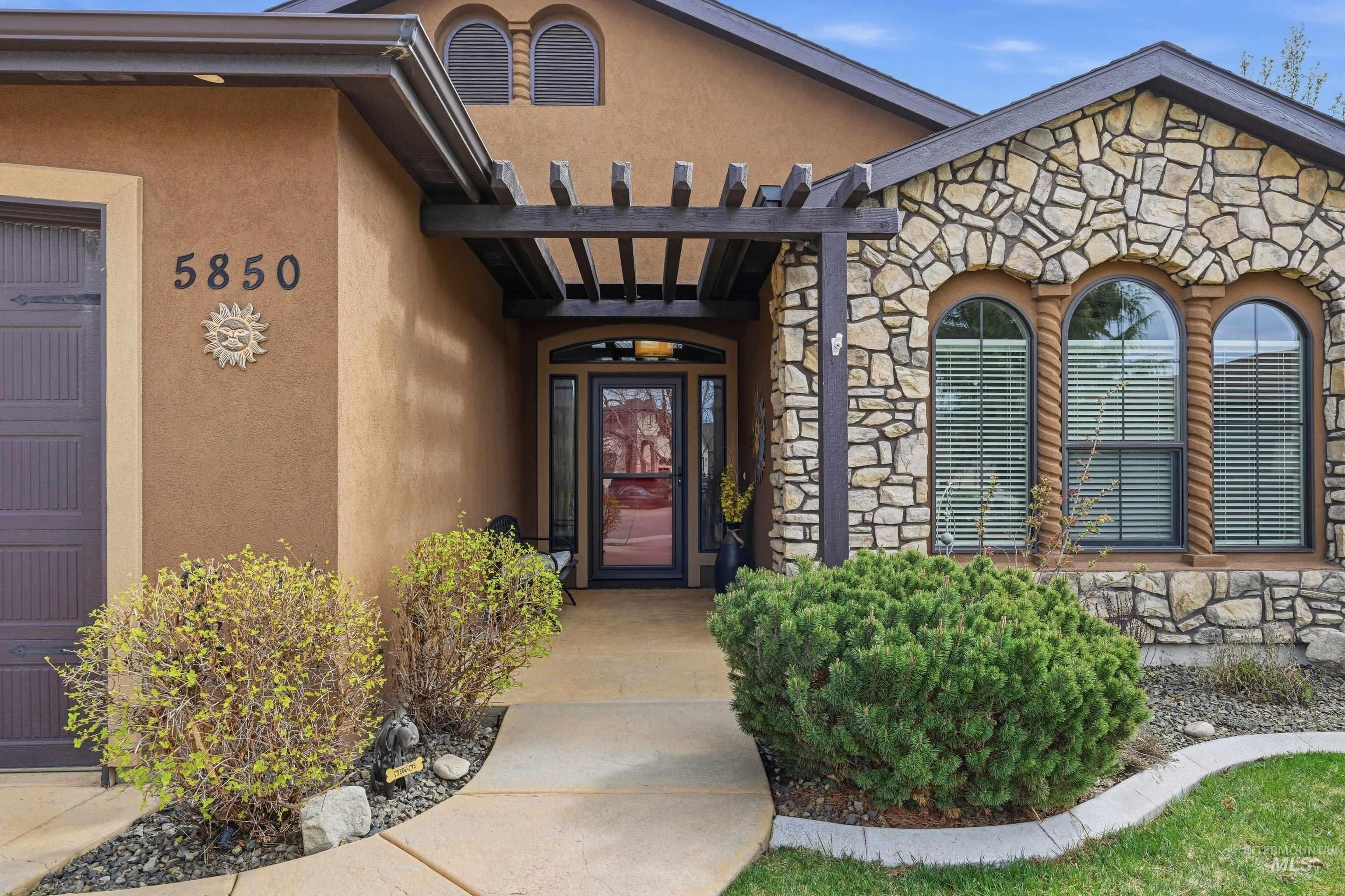 5850 North Rio Lomas Avenue Meridian, ID 83646 - Photo 2 of 50 Entrance to property with stone siding and stucco siding