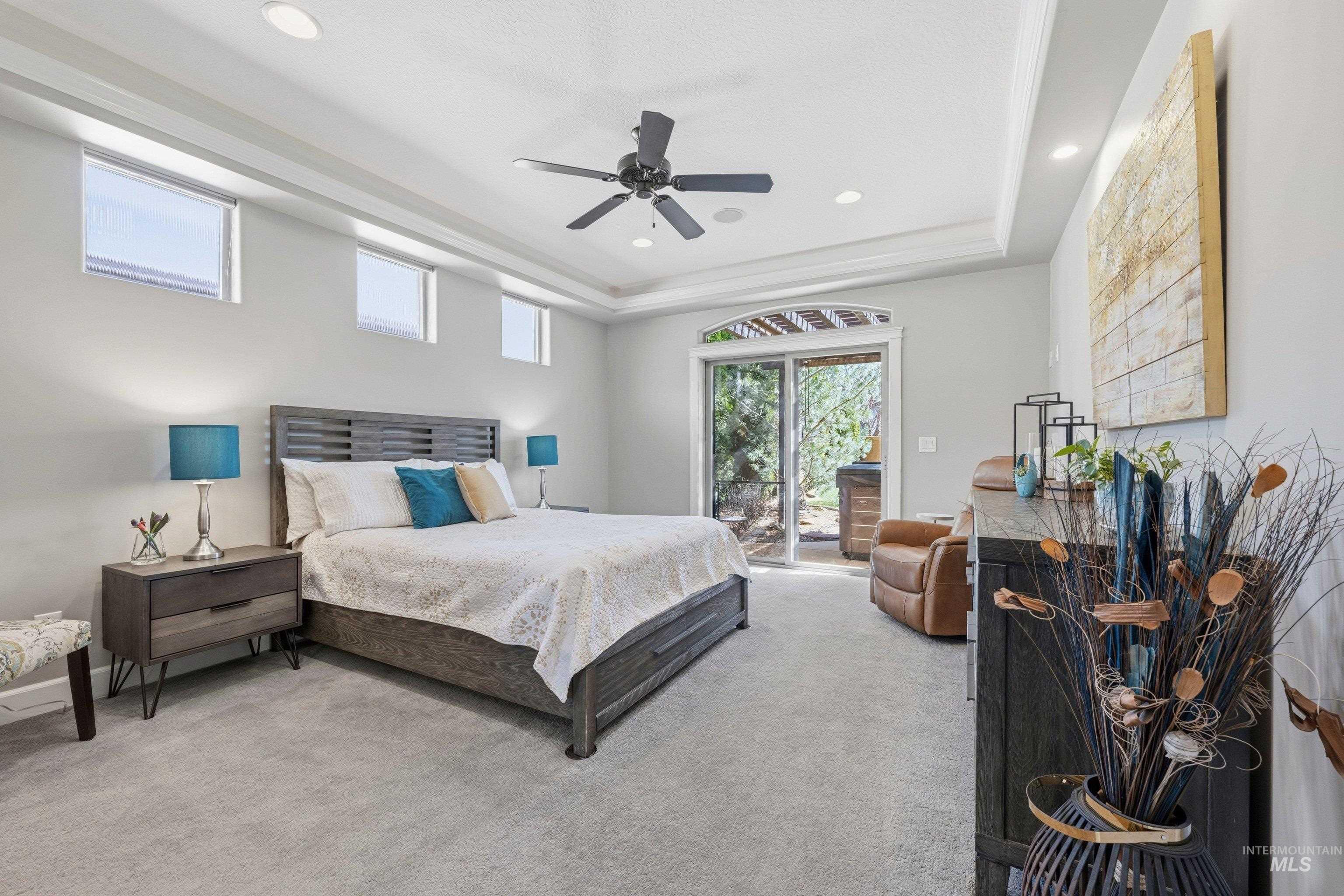 5850 North Rio Lomas Avenue Meridian, ID 83646 - Photo 20 of 50 Bedroom featuring light colored carpet, ceiling fan, a raised ceiling, access to exterior, and recessed lighting