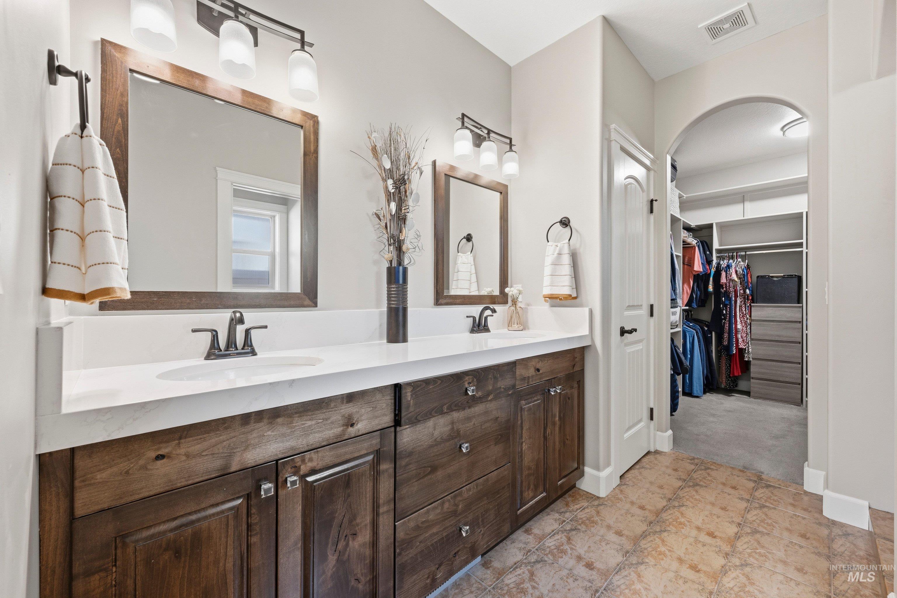 5850 North Rio Lomas Avenue Meridian, ID 83646 - Photo 23 of 50 Bathroom featuring double vanity and a spacious closet