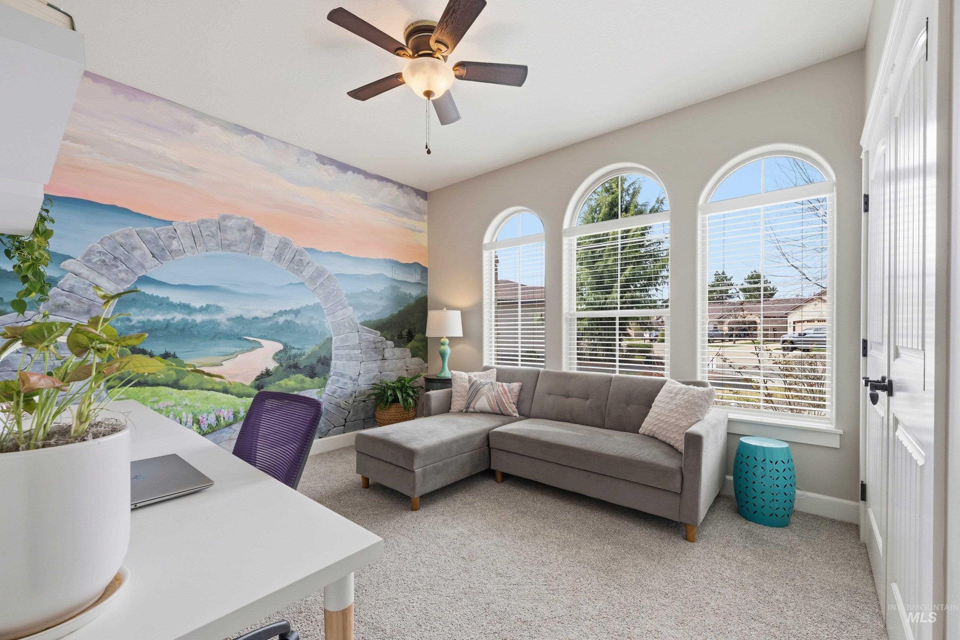 5850 North Rio Lomas Avenue Meridian, ID 83646 - Photo 26 of 50 Living room featuring ceiling fan, light carpet, an accent wall, and a desk