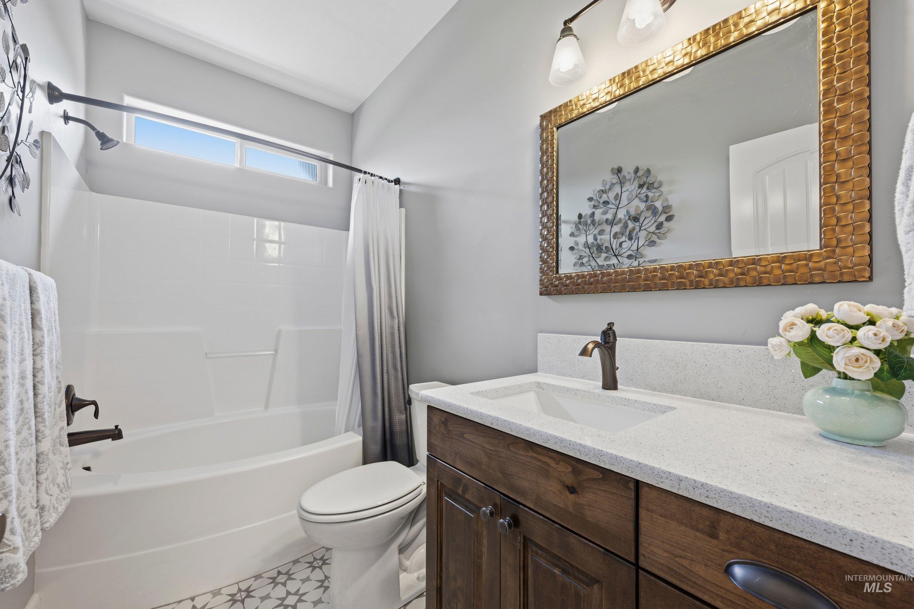 5850 North Rio Lomas Avenue Meridian, ID 83646 - Photo 27 of 50 Full bathroom with vanity and shower / bath combo with shower curtain