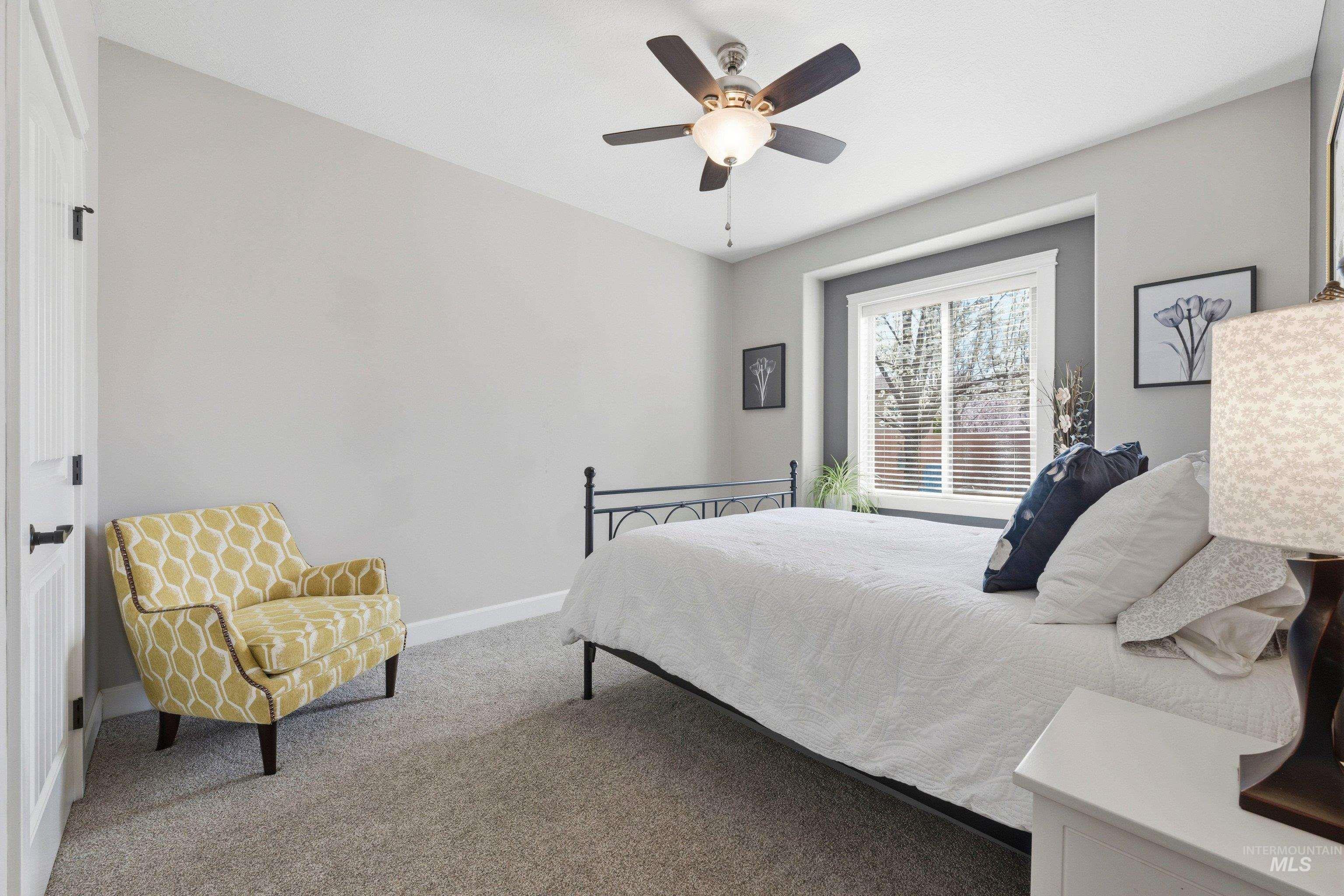 5850 North Rio Lomas Avenue Meridian, ID 83646 - Photo 28 of 50 Carpeted bedroom with baseboards and a ceiling fan