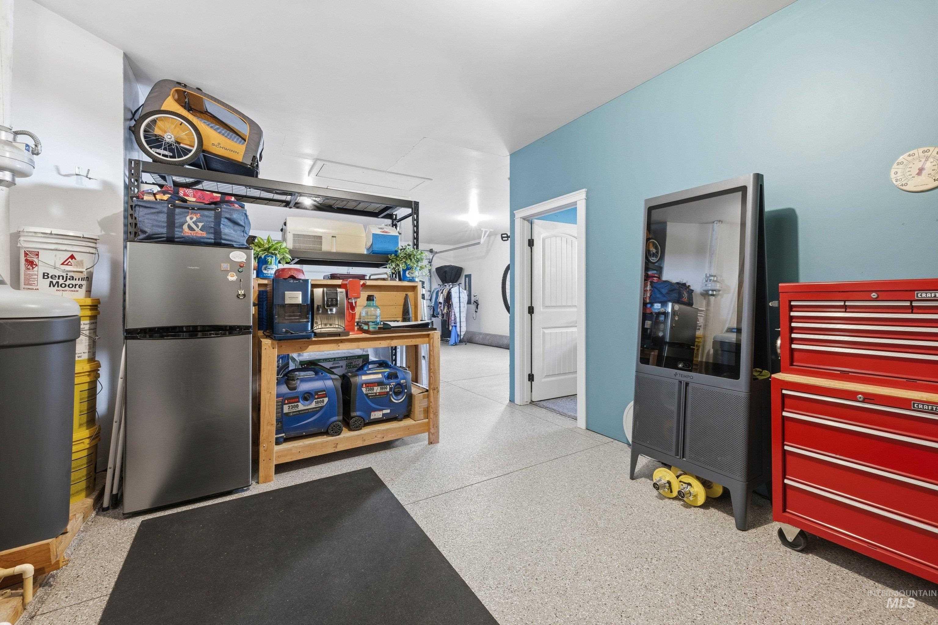 5850 North Rio Lomas Avenue Meridian, ID 83646 - Photo 31 of 50 Kitchen with freestanding refrigerator and dark aggregate flooring