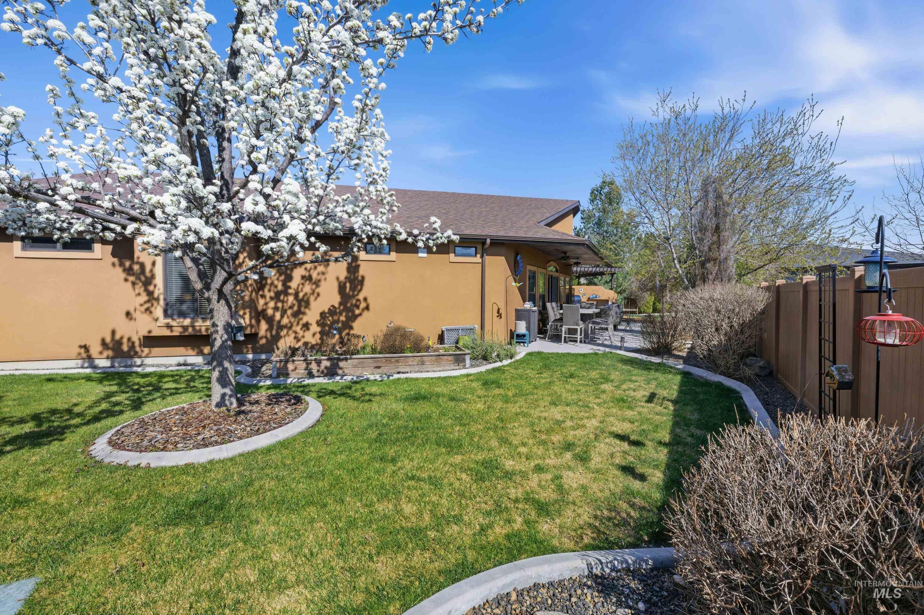 5850 North Rio Lomas Avenue Meridian, ID 83646 - Photo 39 of 50 Fenced backyard with a patio area