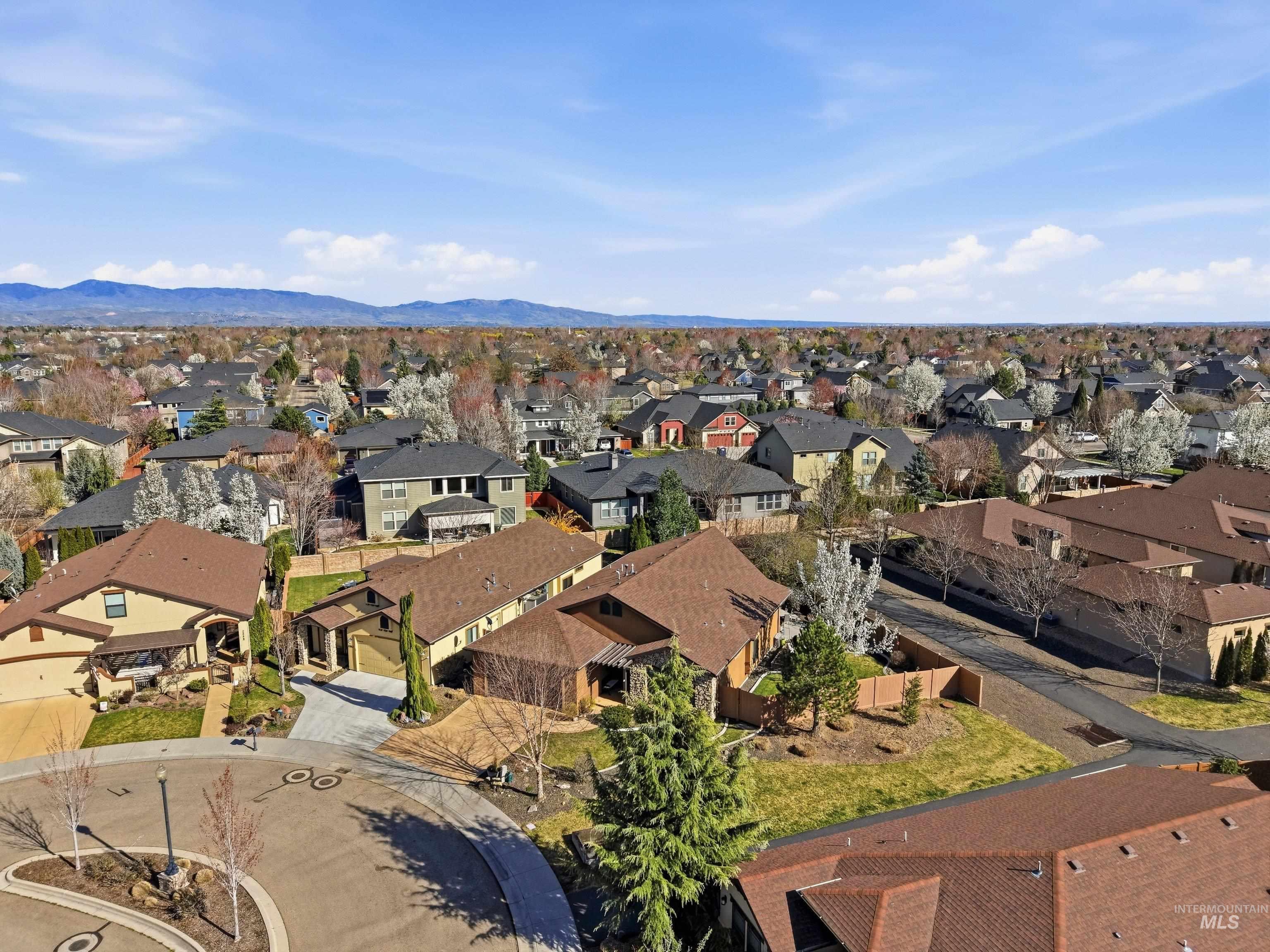 5850 North Rio Lomas Avenue Meridian, ID 83646 - Photo 4 of 50 Aerial perspective of suburban area with mountains
