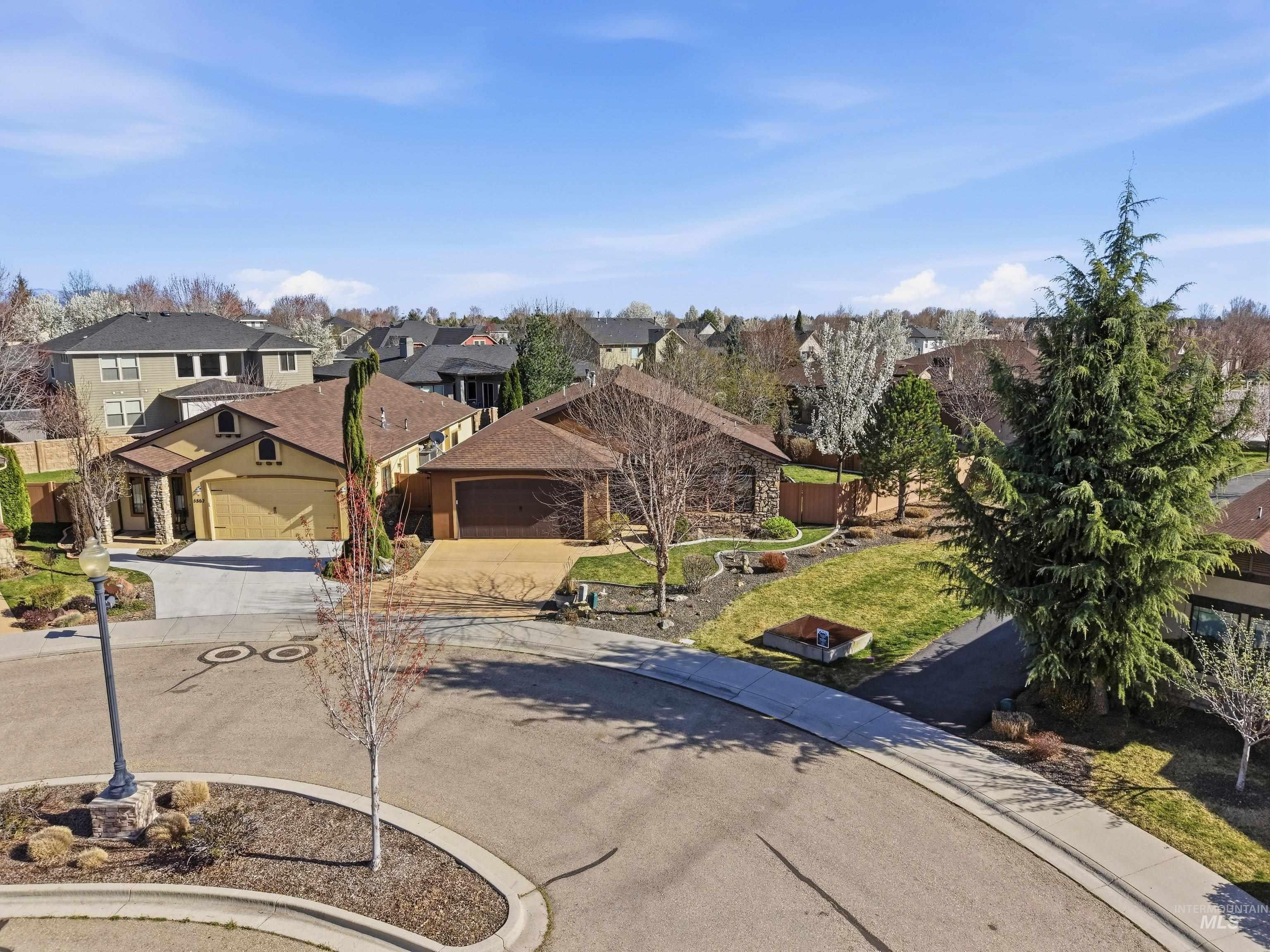 5850 North Rio Lomas Avenue Meridian, ID 83646 - Photo 44 of 50 View of front of house featuring concrete driveway, a residential view, and an attached garage