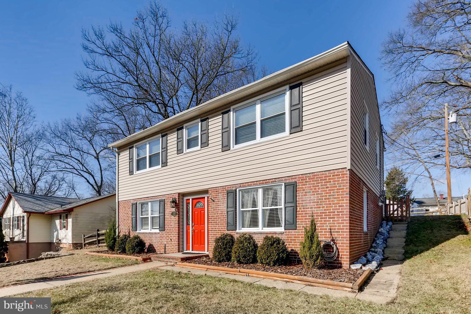 2406 Old Frederick Road Baltimore, MD 21228 - Photo 2 of 25 a front view of a house with garden
