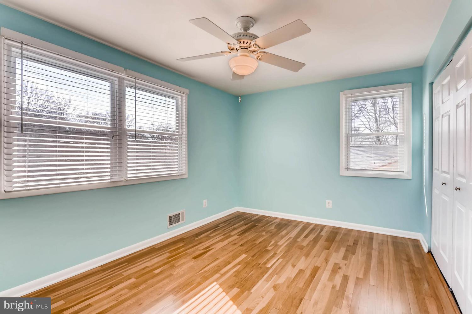 2406 Old Frederick Road Baltimore, MD 21228 - Photo 12 of 25 wooden floor in an empty room with a window