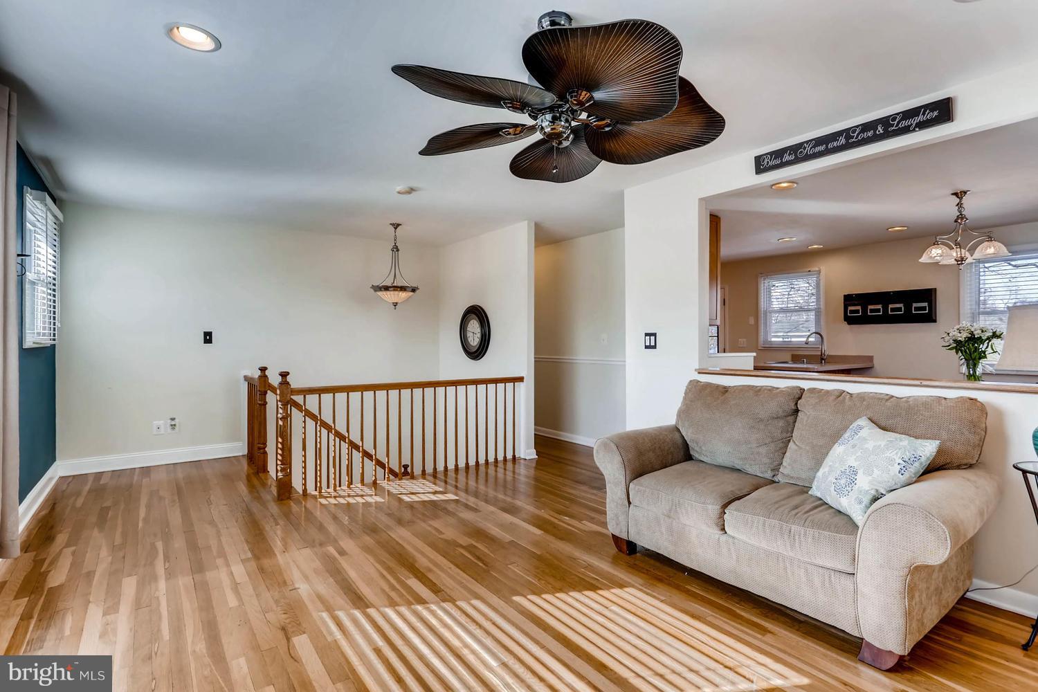 2406 Old Frederick Road Baltimore, MD 21228 - Photo 25 of 25 a living room with furniture and a wooden floor