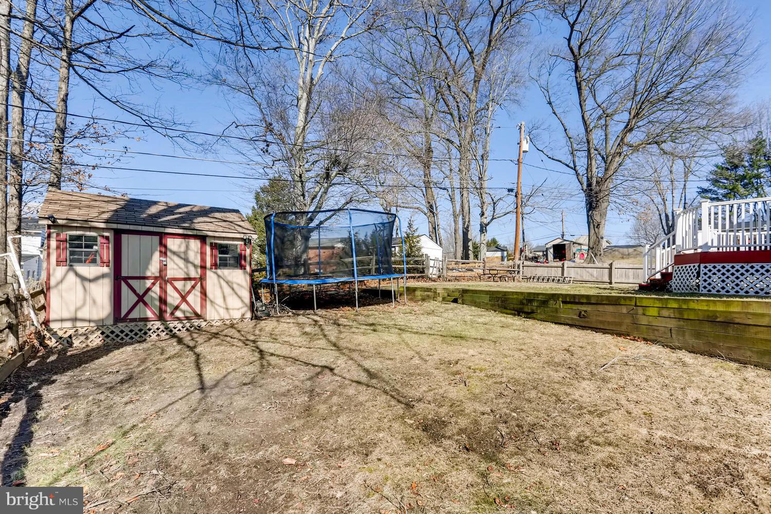2406 Old Frederick Road Baltimore, MD 21228 - Photo 22 of 25 a view of a swimming pool with a house