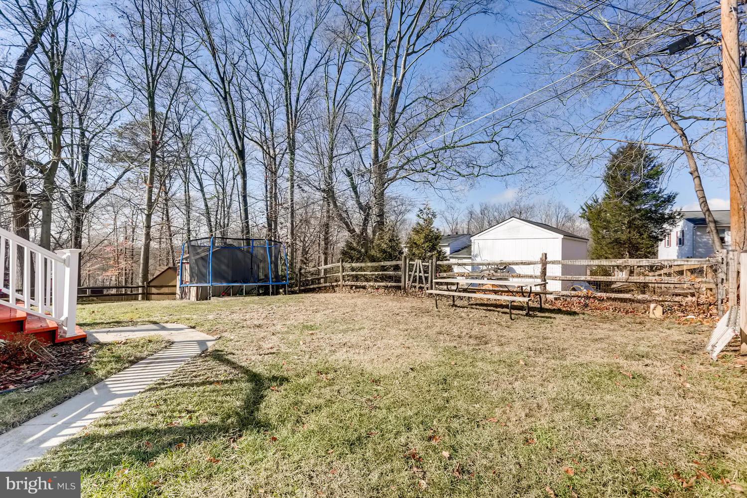 2406 Old Frederick Road Baltimore, MD 21228 - Photo 24 of 25 a view of a yard with a tree