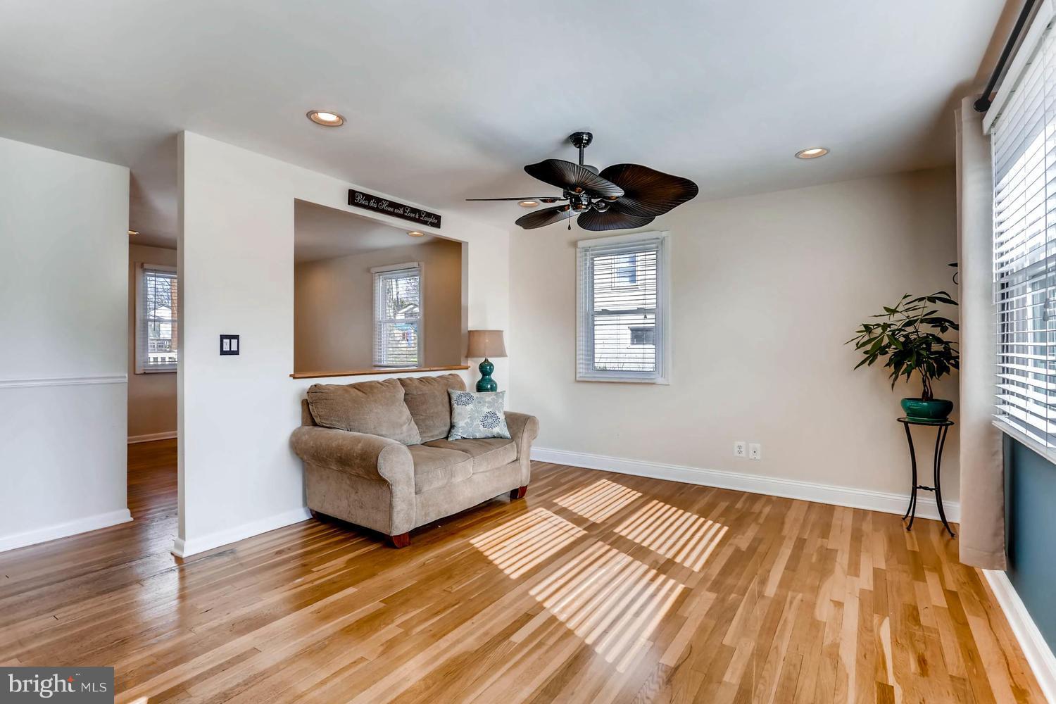 2406 Old Frederick Road Baltimore, MD 21228 - Photo 3 of 25 a view of an empty room and wooden floor