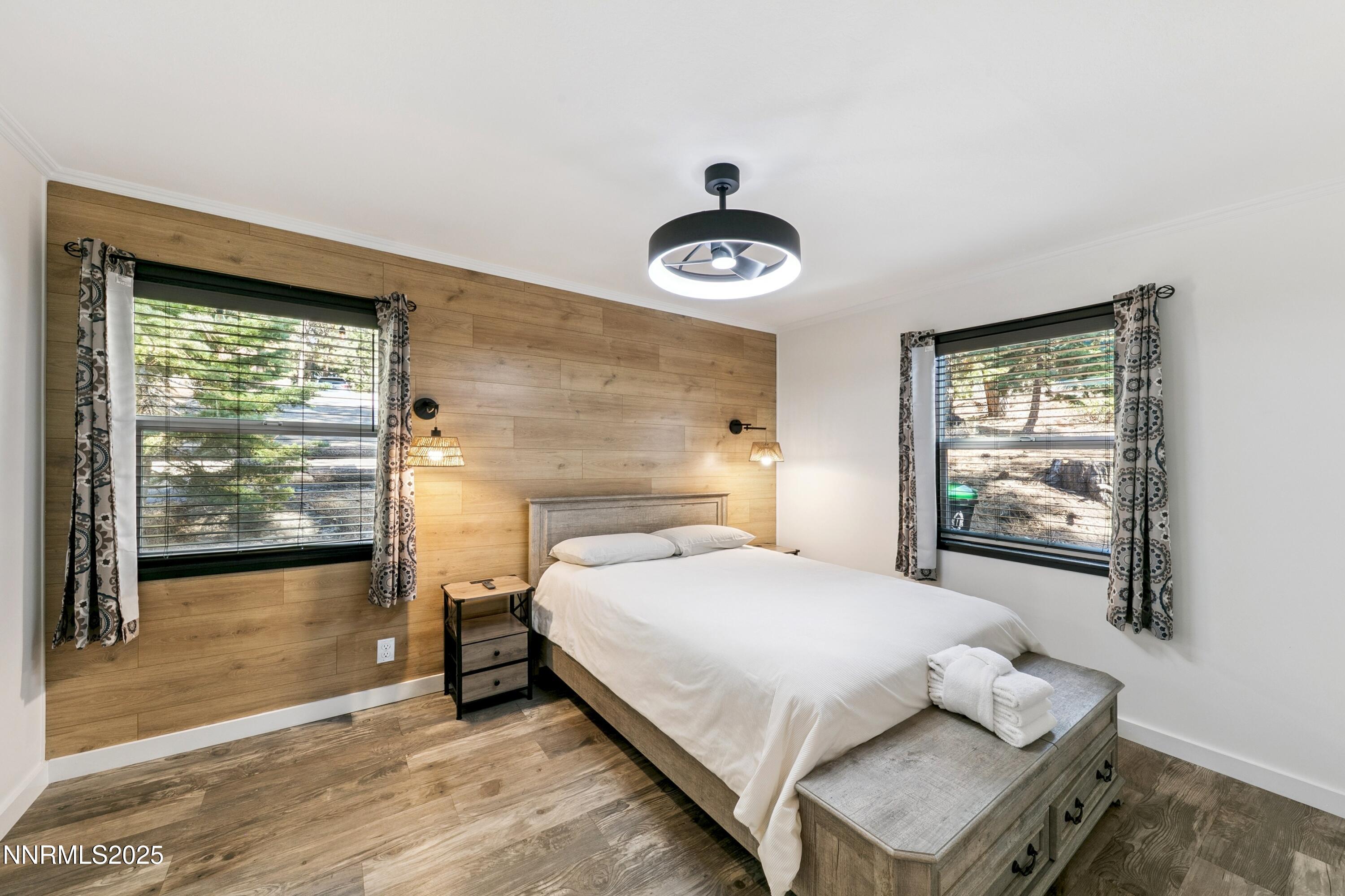 150 Woodland Way Stateline, NV 89449 - Photo 11 of 22 a bedroom with a bed and window